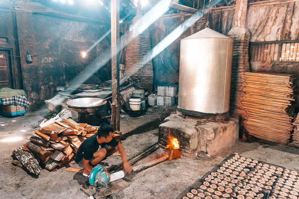 Guy working in a local krupuk factory near Yogyakarta