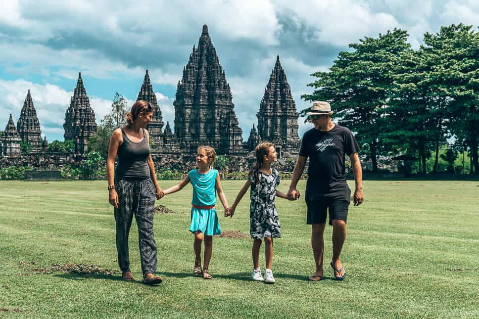 Family walking in front of the Prambanan temples on Java