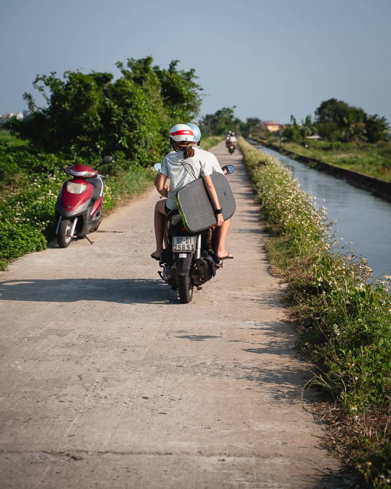 Driving a scooter through the rice fields of Hoi An