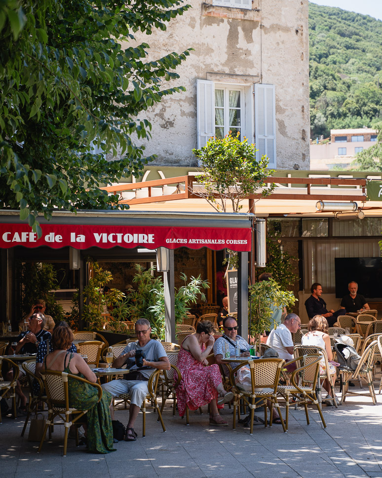 Square with cafés in the mountain village of Sartène in Corsica.