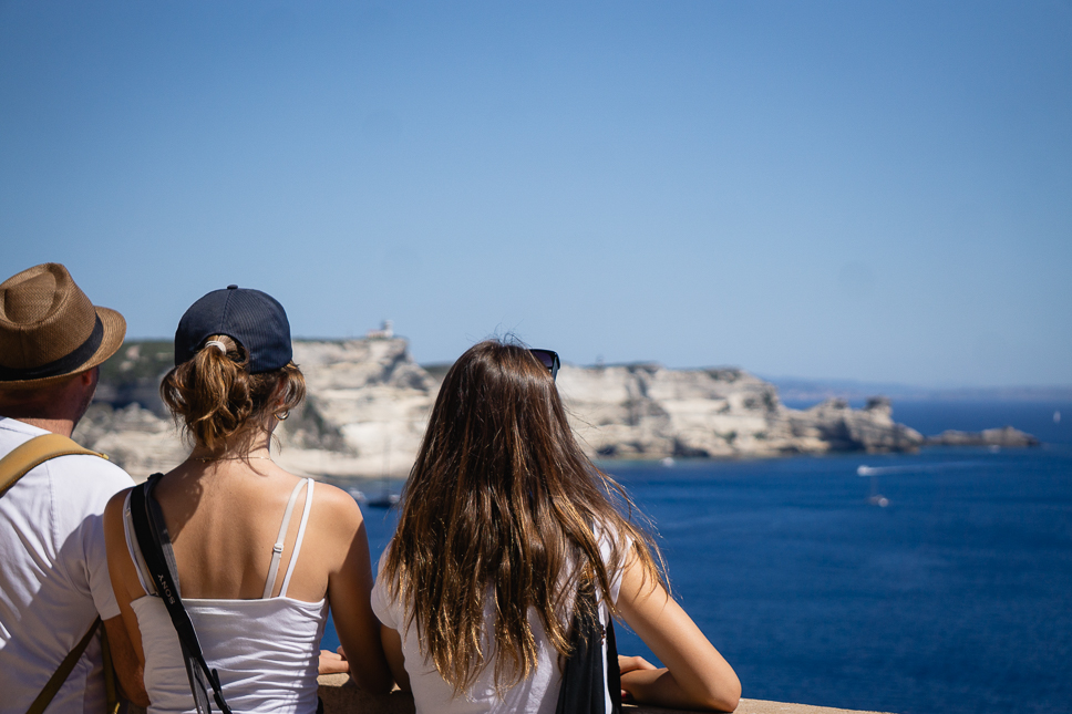 Family looking out over the cliffs of Bonifacio from the citadel in Corsica.