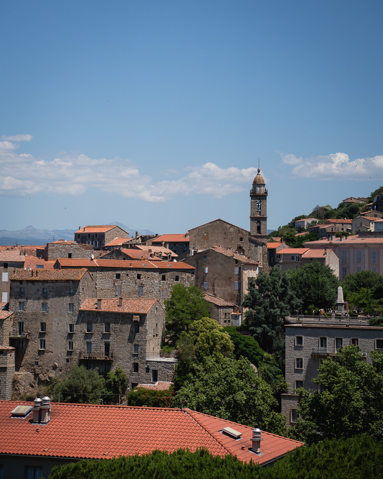 View of the mountain village of Sartène and the church in Corsica.